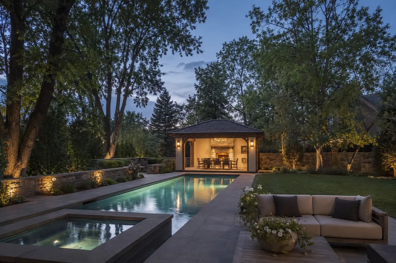 Illustrative Bow Mar estate with a linear pool, spa, pavilion, mature trees, and landscape screening