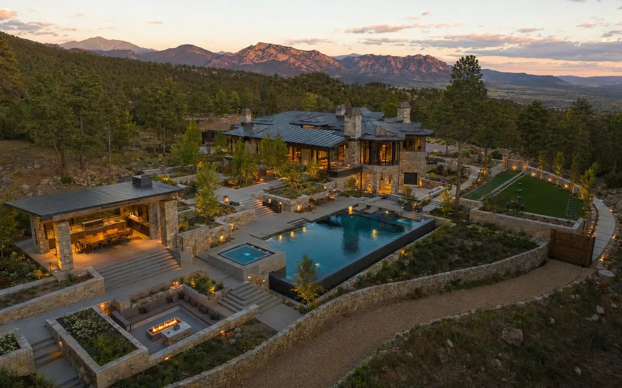 Illustrative aerial study of a five-million-dollar Colorado outdoor estate with a pool, pavilion, fire lounge, terraces, and mature landscape